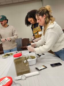 3 people packing spices