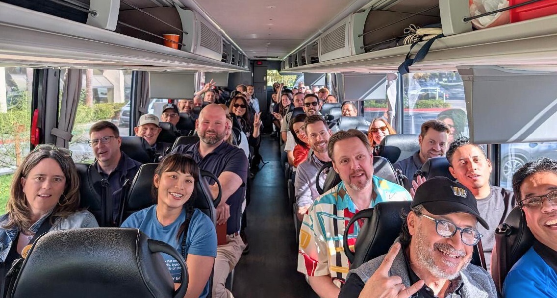 Conference attendees on the bus going on a city tour