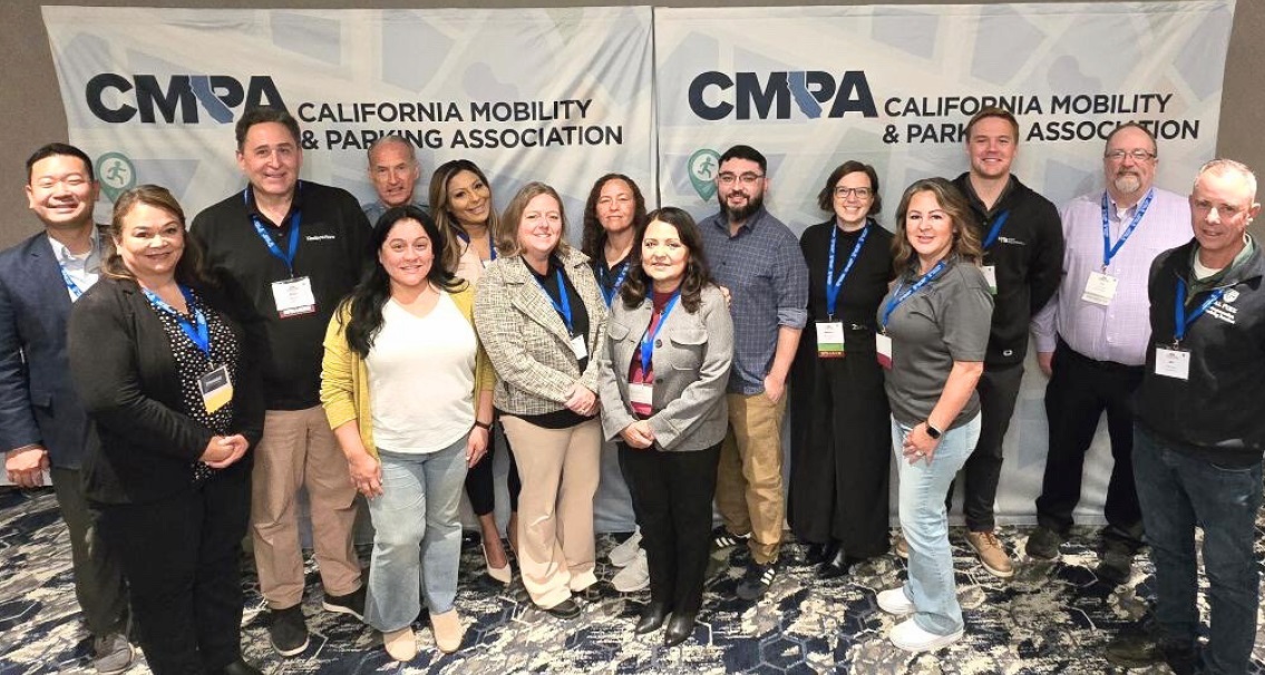 Attendees posing for a photo at the conference