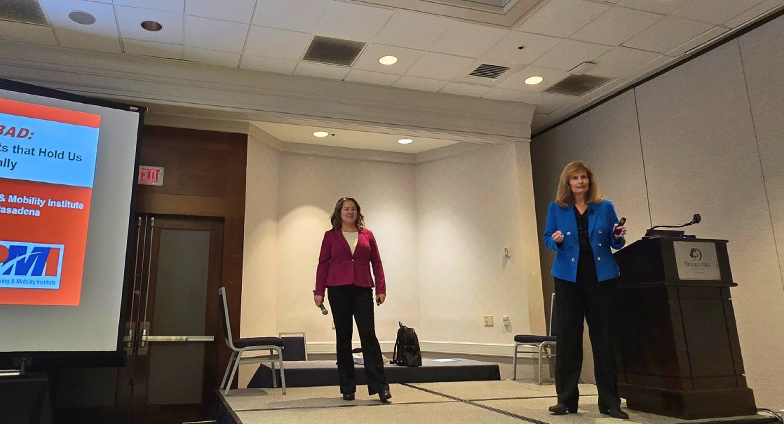 Conference speakers engaging with the audience