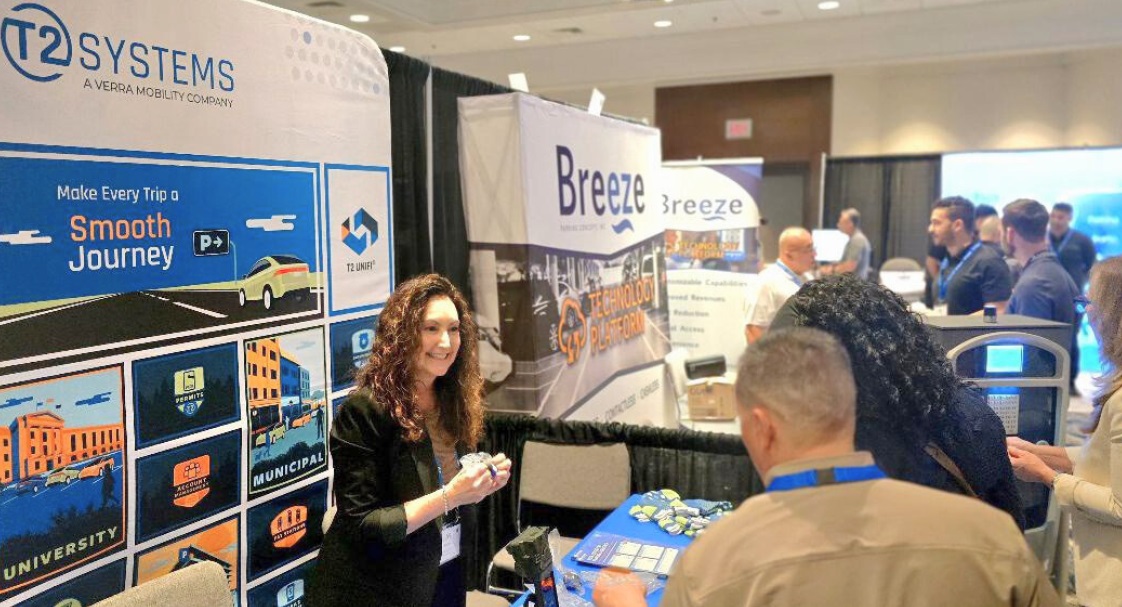 Attendees discussing latest parking technology