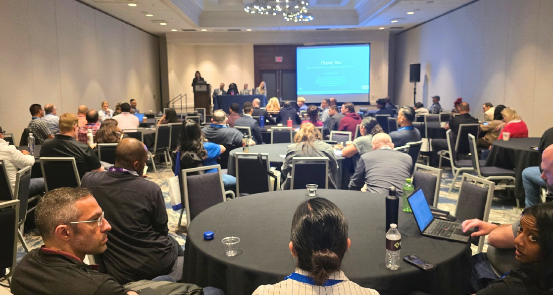 Conference attendees enjoying a presentation