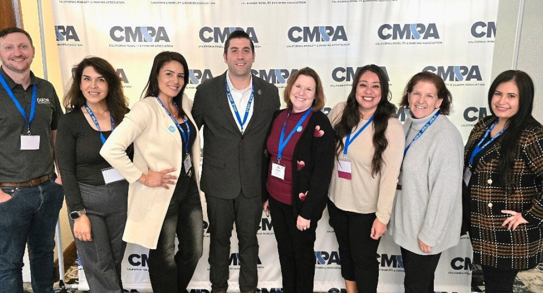 Conference attendees posing for a group photo