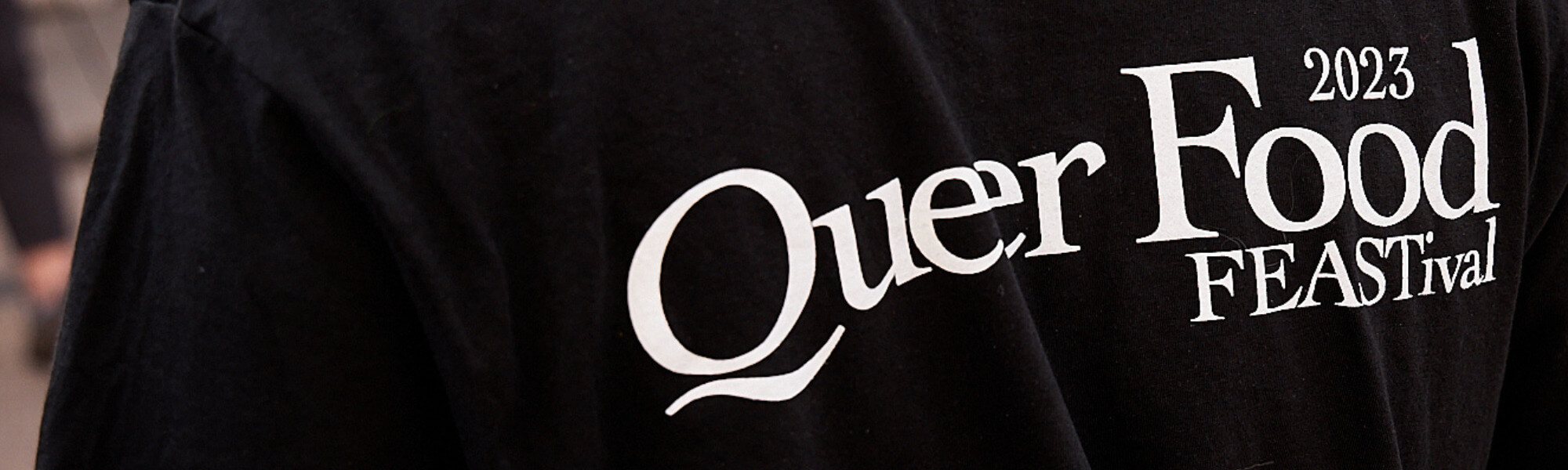 t shirt logo up close of queer food feastival
